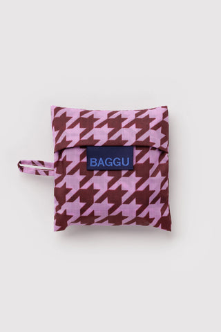 Folded Baby BAGGU pink houndstooth pouch with BAGGU logo
