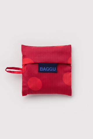 Foldable red polka-dot BAGGU baby bag with logo patch and wrist strap