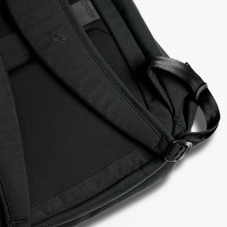 Close-up of a black backpack strap on a white background