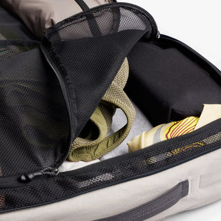 Open backpack with clothes inside