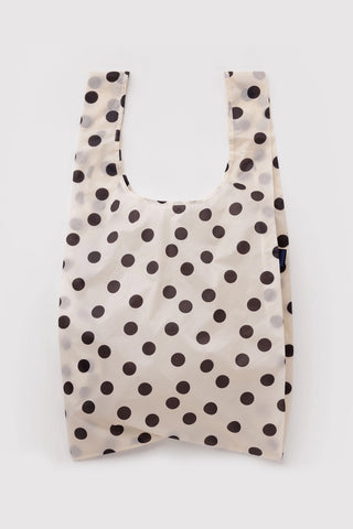Cream tote bag with black polka dots, open top and wide shoulder straps