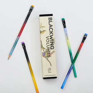 Gradient pencils with 'Blackwing Volumes' packaging on a white background