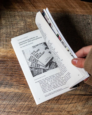 Open book spread with dense text and small illustration