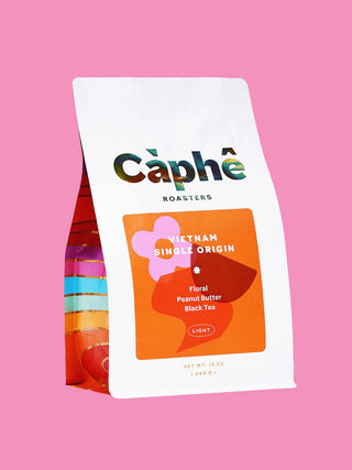 A bag of Cèphé Roasters Vietnam Single Origin Light Roast, shown on a solid pink background.