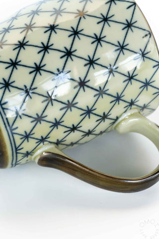 Celadon lattice mug close-up of interior and handle, cream with blue star lattice