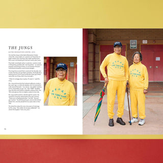 Two people in matching yellow outfits with text.