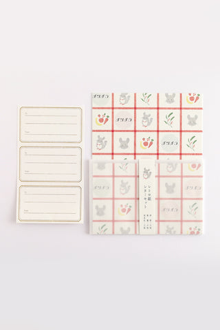Envelope seals next to envelopes and paper with chinchilla design