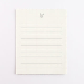 White lined pages on a light gray background