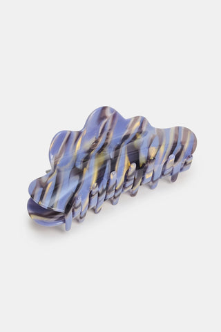 Blue and amber marble claw clip with ridged teeth, glossy finish