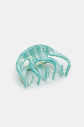 Large octopus claw hair clip, light blue translucent with ridged tentacles.