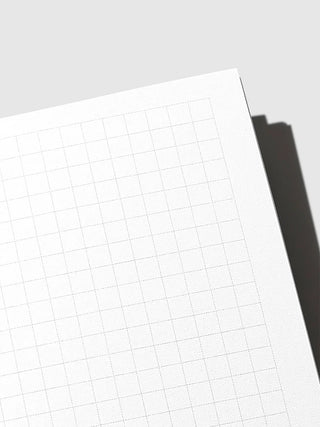 Close-up of travel notebook graph grid paper with fine lines