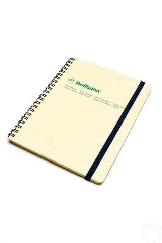 Cream Rollbahn spiral notebook with green logo and dark blue elastic band