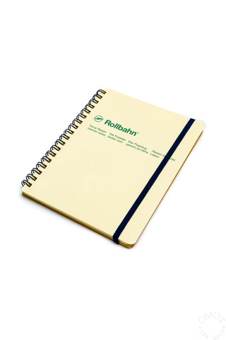 Cream Rollbahn spiral notebook with blue elastic band and centered green logo