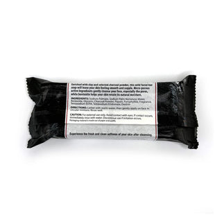 Clay & charcoal facial cleansing bar soap with back label on black wrap