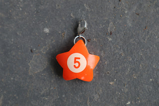 Orange wonky star charm with white '5' and metal jump ring, single charm shown