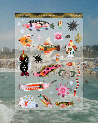 Sheet of colorful fish stickers with a beach scene in the background
