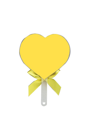 Yellow heart-shaped hand fan with a ribbon on a white background