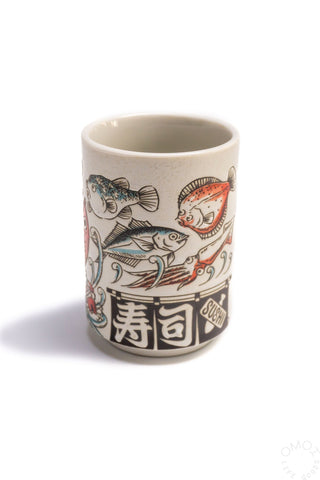 Fish teacup, cream ceramic with blue and red fish illustration on sides
