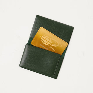 Opened green card case with card coming out on a white background