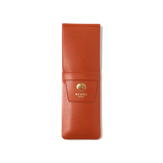 Orange pen case with Beams Japan logo on a white background