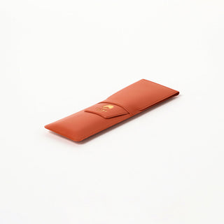Orange pen case with Beams Japan logo on a white background