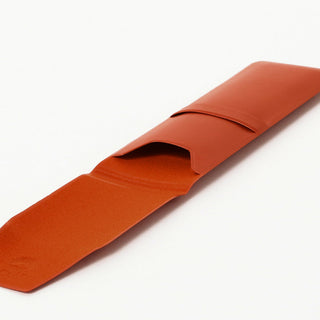 Opened orange pen case with Beams Japan logo on a white background