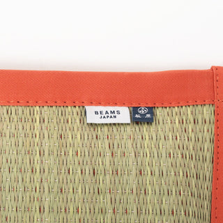 Textile cushion with 'BEAMS JAPAN' label on a white background