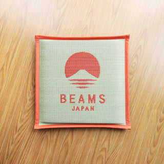 Beams Japan cushion on a wooden surface