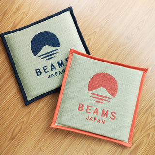 Two BEAMS Japan cushions on a wooden surface