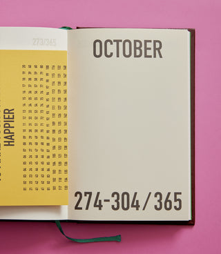 Open planner showing October page with a pink background