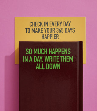 Journal with motivational text on a pink background