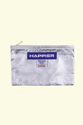 silver pouch with 'Happier' branding on a light yellow background