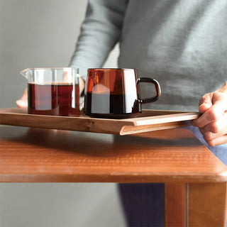 600 ml amber glass jug with side handle on wooden serving tray