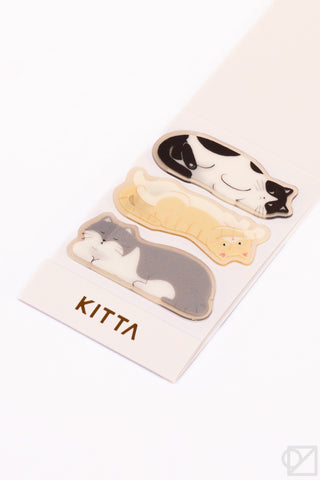 Cat shaped die cut stickers with 'KITTA' branding.
