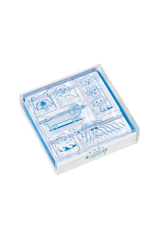 Dog-themed clear stamp set in blue outline, in a plastic case