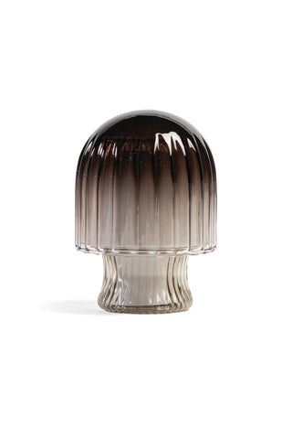 Smoky glass candle with gradient color on a white background