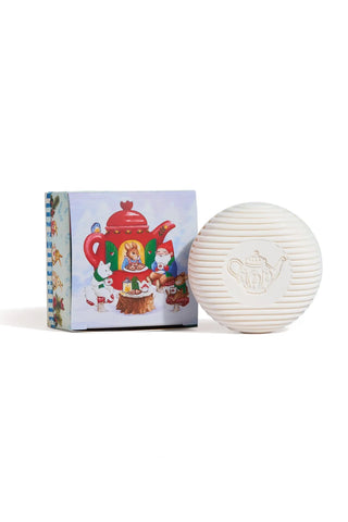 Gnome-themed round soap bar with embossed face, shown with colorful gift box