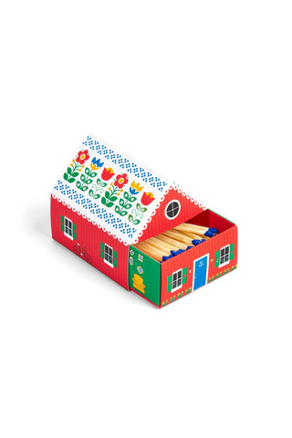 Colorful matchbox hosue packaging with floral design on a white background