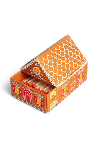 Open gingerbread matchbox cottage with red interior and patterned side walls