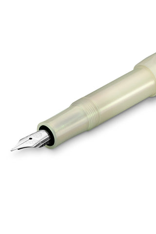 Light green fountain pen nib close-up with fine tip and feed