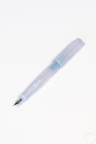 Iridescent pearl fountain pen with silver nib and light blue translucent barrel