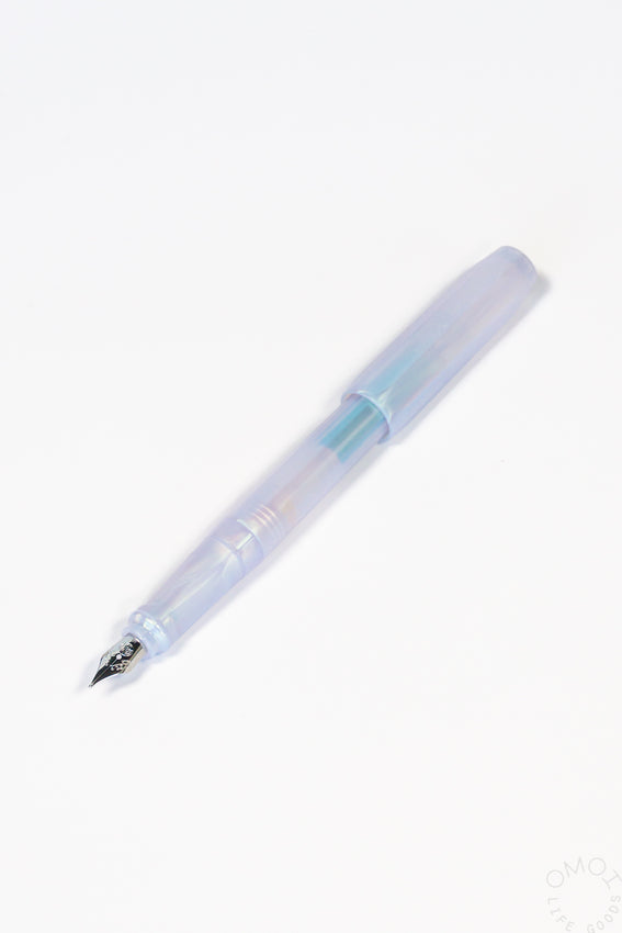 Iridescent pearl fountain pen with silver nib and light blue translucent barrel