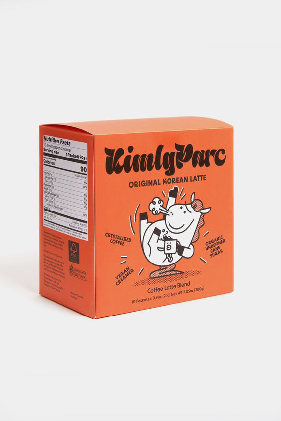 Orange instant latte mix carton with cartoon character on the front label