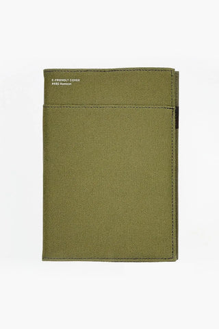 Green fabric notebook cover on a white background