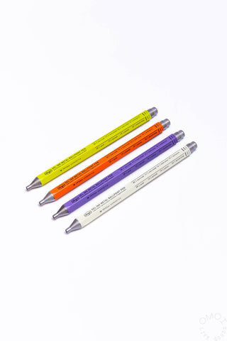 Colorful pens (yellow, orange, purple, and white) on a white background