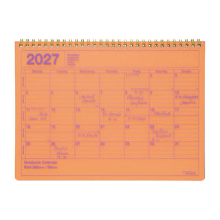 neon orange monthly notebook calendar on a light background