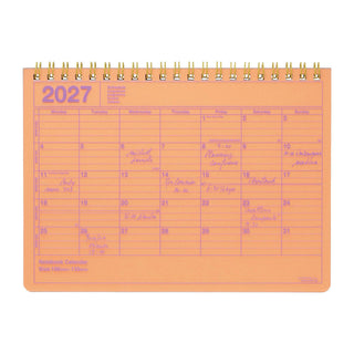 Neon orange 2027 monthly notebook calendar on a white background