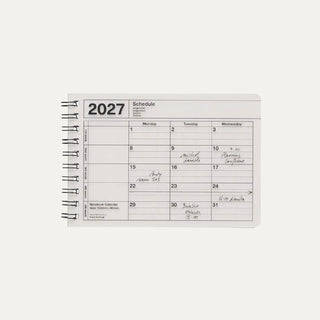 Small ivory monthly calendar on a light background