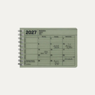 Small khaki monthly calendar on a light background