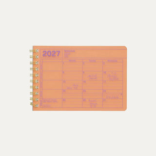 Small neon orange monthly calendar on a light background